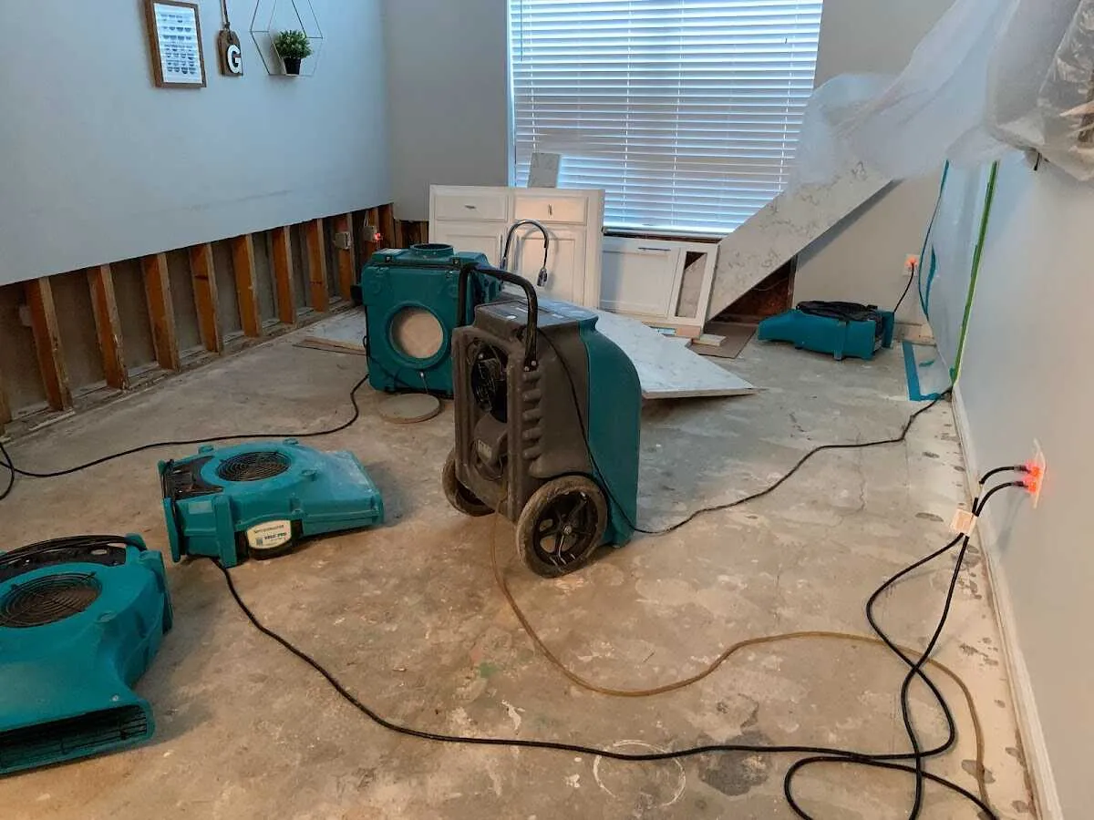 Dehumidifier in flood-cut room for Water Damage Restoration in Monument